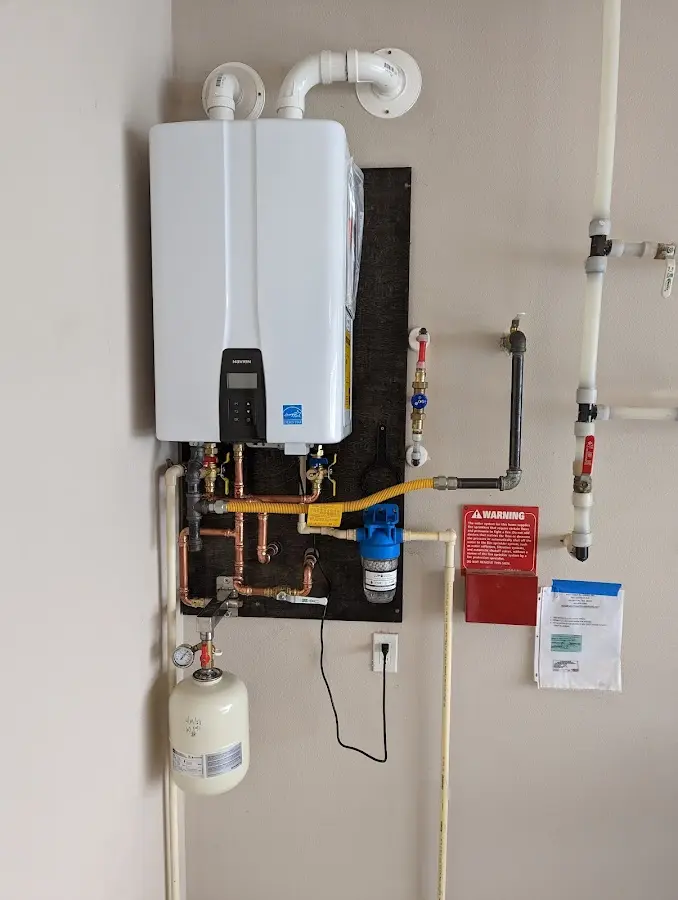 Professional plumber installing copper piping in a Sanibel home